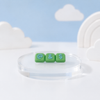 Green Modular Keyboard Clicker caps with Light Blue @, ampersand, and dollar symbols