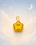 Yellow star keychain clicker on a dreamy celestial background
